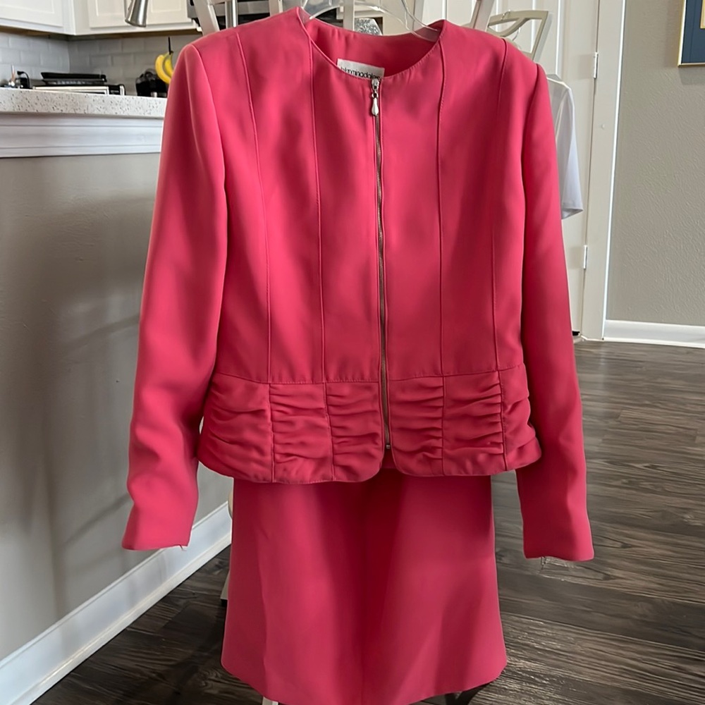 Pink skirt and jacket suit. Skirt has back slit and hook and zipper close